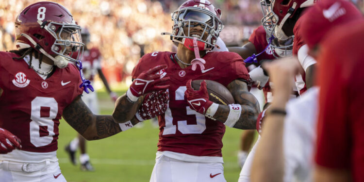 Alabama defensive back Malachi Moore (13) celebrates after an interception during the first half of an NCAA college football game against Missouri, Saturday, Oct. 26, 2024, in Tuscaloosa, Ala. (AP Photo/Vasha Hunt)