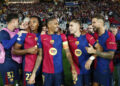 Barcelona's Raphinha, centre, celebrates with teammates after scoring his sides forth goal during a Champions League opening phase soccer match between Barcelona and Bayern Munich at the Lluis Companys Olympic Stadium in Barcelona, Spain, Wednesday, Oct. 23, 2024. (AP Photo/Joan Monfort)