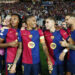 Barcelona's Raphinha, centre, celebrates with teammates after scoring his sides forth goal during a Champions League opening phase soccer match between Barcelona and Bayern Munich at the Lluis Companys Olympic Stadium in Barcelona, Spain, Wednesday, Oct. 23, 2024. (AP Photo/Joan Monfort)