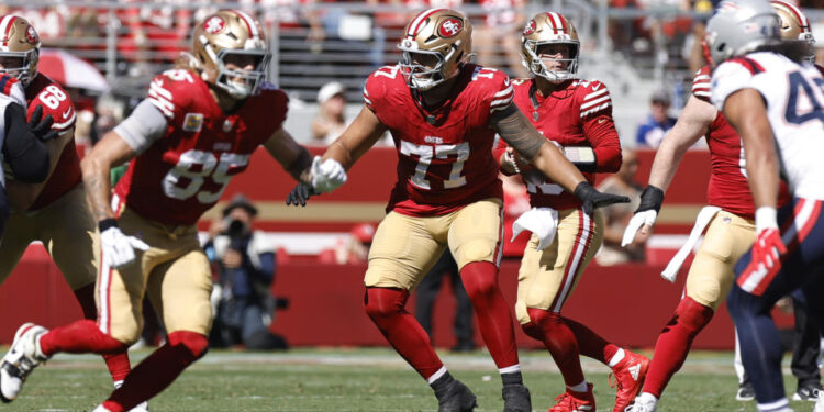 SANTA CLARA, CA - SEPTEMBER 29: Dominick Puni #77 of the San Francisco 49ers blocks during the game against the New England Patriots at Levi's Stadium on September 29, 2024 in Santa Clara, California. The 49ers defeated the Patriots 30-13. (Photo by Michael Zagaris/San Francisco 49ers/Getty Images)