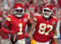 Xavier Worthy celebrates with Travis Kelce