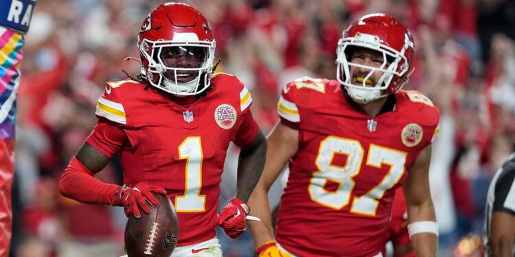 Xavier Worthy celebrates with Travis Kelce