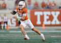 AUSTIN, TEXAS - SEPTEMBER 28: Arch Manning #16 of the Texas Longhorns scrambles in the second half against the Mississippi State Bulldogs at Darrell K Royal-Texas Memorial Stadium on September 28, 2024 in Austin, Texas. (Photo by Tim Warner/Getty Images)