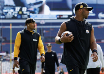 DENVER, CO - SEPTEMBER 15: Quarterback Justin Fields #2 of the Pittsburgh Steelers and quarterback Russell Wilson #3 stand on the field prior to an NFL football game against the Denver Broncos, at Empower Field at Mile High on September 15, 2024 in Denver, Colorado. (Photo by Brooke Sutton/Getty Images)