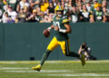 Sep 29, 2024; Green Bay, Wisconsin, USA;  Green Bay Packers quarterback Jordan Love (10) looks to throw a pass during the fourth quarter against the Minnesota Vikings at Lambeau Field. Mandatory Credit: Jeff Hanisch-Imagn Images