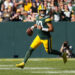 Sep 29, 2024; Green Bay, Wisconsin, USA;  Green Bay Packers quarterback Jordan Love (10) looks to throw a pass during the fourth quarter against the Minnesota Vikings at Lambeau Field. Mandatory Credit: Jeff Hanisch-Imagn Images