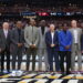 GLENDALE, ARIZONA - APRIL 06: (L-R) John Doleva, Jerry Colangelo, Chauncey Billups, Vince Carter, Michael Cooper, Bo Ryan, Charles Smith, Doug Collins and Herb Simon pose for photos during a ceremony honoring the Naismith Basketball Hall Of Fame Class Of 2024 at halftime of the NCAA Men's Basketball Tournament Final Four semifinal game between the North Carolina State Wolfpack and the Purdue Boilermakers at State Farm Stadium on April 06, 2024 in Glendale, Arizona. (Photo by Christian Petersen/Getty Images)