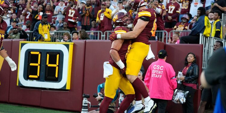 Ben Sinnott celebrates a TD pass