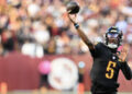 Jayden Daniels completed a Hail Mary with no time left to beat the Chicago Bears. (Photo by Greg Fiume/Getty Images)