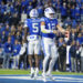 BYU wide receiver Darius Lassiter (5) and quarterback Jake Retzlaff (12) celebrate after Retzlaff ran for a touchdown in the first half of an NCAA college football game against Oklahoma State, Friday, Oct. 18, 2024, in Provo, Utah. (AP Photo/Spenser Heaps)