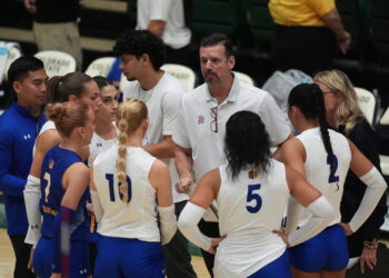 San Jose State head coach Todd Kress, back center, talks to his players during a time out in the first set of an NCAA college volleyball match against Colorado State Thursday, Oct. 3, 2024, in Fort Collins, Colo. (AP Photo/David Zalubowski)