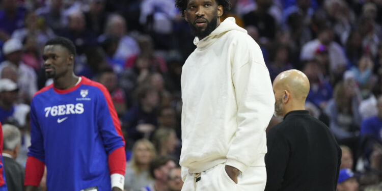 PHILADELPHIA, PENNSYLVANIA - OCTOBER 23: Joel Embiid #21 of the Philadelphia 76ers looks on during a timeout against the Milwaukee Bucks in the first half at the Wells Fargo Center on October 23, 2024 in Philadelphia, Pennsylvania. NOTE TO USER: User expressly acknowledges and agrees that, by downloading and/or using this photograph, user is consenting to the terms and conditions of the Getty Images License Agreement. (Photo by Mitchell Leff/Getty Images)