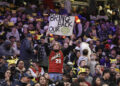 A fan hold up a sign in the stands urging the former Seattle Sonics basketball team to return to Seattle before a preseason NBA basketball game between the Los Angeles Clippers and the Portland Trail Blazers, Friday, Oct. 11, 2024, in Seattle. (AP Photo/John Froschauer)