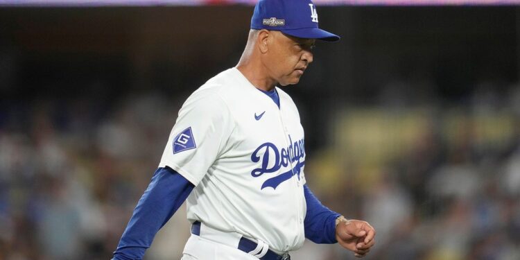 Dave Roberts walks back to the dugout