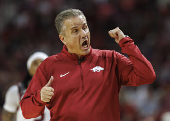 FAYETTEVILLE, ARKANSAS - OCTOBER 25: Head Coach John Calipari of the Arkansas Razorbacks directs his team during a game against the Kansas Jayhawks at Bud Walton Arena on October 25, 2024 in Fayetteville, Arkansas. The Razorbacks defeated the Jayhawks 85-69.  (Photo by Wesley Hitt/Getty Images)