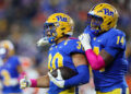 PITTSBURGH, PA - OCTOBER 24: Pittsburgh Panthers linebacker Brandon George (30) and Pittsburgh Panthers defensive lineman Chief Borders (14) celebrate after George made an interception during the first quarter of the college football game between the Syracuse Orange and Pittsburgh Panthers on October 24, 2024, at Acrisure Stadium in Pittsburgh, PA. (Photo by Frank Jansky/Icon Sportswire via Getty Images)