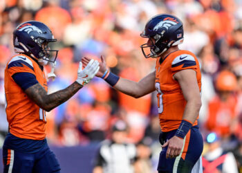 DENVER, COLORADO - OCTOBER 13:  Troy Franklin #16 and Bo Nix #10 of the Denver Broncos celebrate after a fourth quarter touchdown against the Los Angeles Chargers at Empower Field at Mile High on October 13, 2024 in Denver, Colorado. (Photo by Dustin Bradford/Getty Images)