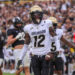 Sep 28, 2024; Orlando, Florida, USA; Colorado Buffaloes wide receiver Travis Hunter (12) scores a touchdown against the UCF Knights during the first quarter at FBC Mortgage Stadium. Mandatory Credit: Mike Watters-Imagn Images