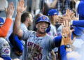 Los Angeles, CA - October 14:  Pete Alonso #20 of the New York Mets high fives teammates after scoring on a RBI double by teammate Starling Marte (not pictured) of the New York Mets against the Los Angeles Dodgers in the ninth inning of game 2 of a National League Championship Series playoff baseball game at Dodger Stadium in Los Angeles on Monday, October 14, 2024. (Photo by Keith Birmingham/MediaNews Group/Pasadena Star-News via Getty Images)