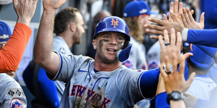 Los Angeles, CA - October 14:  Pete Alonso #20 of the New York Mets high fives teammates after scoring on a RBI double by teammate Starling Marte (not pictured) of the New York Mets against the Los Angeles Dodgers in the ninth inning of game 2 of a National League Championship Series playoff baseball game at Dodger Stadium in Los Angeles on Monday, October 14, 2024. (Photo by Keith Birmingham/MediaNews Group/Pasadena Star-News via Getty Images)