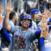 Los Angeles, CA - October 14:  Pete Alonso #20 of the New York Mets high fives teammates after scoring on a RBI double by teammate Starling Marte (not pictured) of the New York Mets against the Los Angeles Dodgers in the ninth inning of game 2 of a National League Championship Series playoff baseball game at Dodger Stadium in Los Angeles on Monday, October 14, 2024. (Photo by Keith Birmingham/MediaNews Group/Pasadena Star-News via Getty Images)