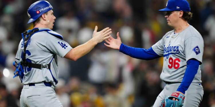 SAN DIEGO, CA - OCTOBER 09:   Will Smith #16 and Landon Knack #96 of the Los Angeles Dodgers celebrate after winning Game 4 of the Division Series presented by Booking.com between the Los Angeles Dodgers and the San Diego Padres at Petco Park on Wednesday, October 9, 2024 in San Diego, California. (Photo by Daniel Shirey/MLB Photos via Getty Images)