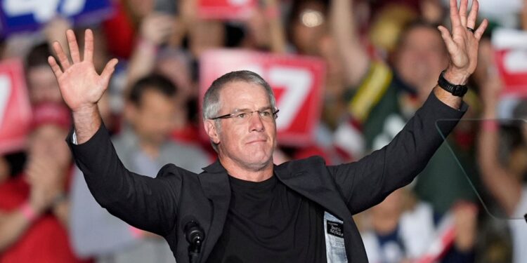 Former Green Bay Packers quarterback Brett Favre speaks before Republican presidential nominee former President Trump at a campaign rally at the Resch Center, Wednesday, in Green Bay, Wis.