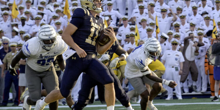 ANNAPOLIS, MD - SEPTEMBER 21:  Navy Midshipmen quarterback Blake Horvath (11) runs for a touchdown during the Memphis Tigers game versus the Naval Academy Midshipmen on September 21, 2024 at Navy - Marine Corps Memorial Stadium in Annapolis, MD. (Photo by Mark Goldman/Icon Sportswire via Getty Images)