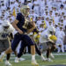 ANNAPOLIS, MD - SEPTEMBER 21:  Navy Midshipmen quarterback Blake Horvath (11) runs for a touchdown during the Memphis Tigers game versus the Naval Academy Midshipmen on September 21, 2024 at Navy - Marine Corps Memorial Stadium in Annapolis, MD. (Photo by Mark Goldman/Icon Sportswire via Getty Images)