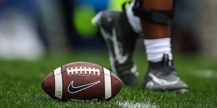 A football sits on turf