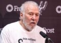 Gregg Popovich talks to reporters