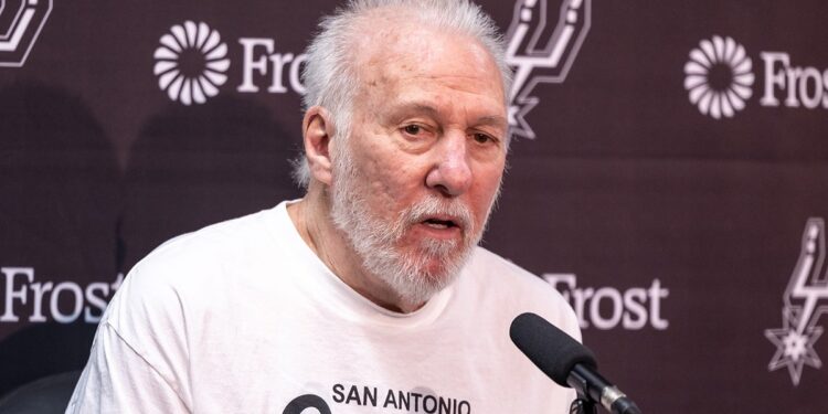 Gregg Popovich talks to reporters