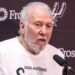 Gregg Popovich talks to reporters