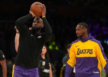 LeBron and Bronny James warm up