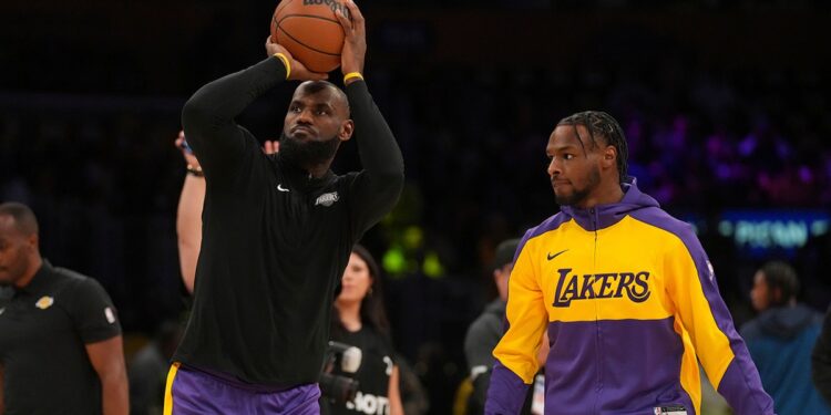 LeBron and Bronny James warm up