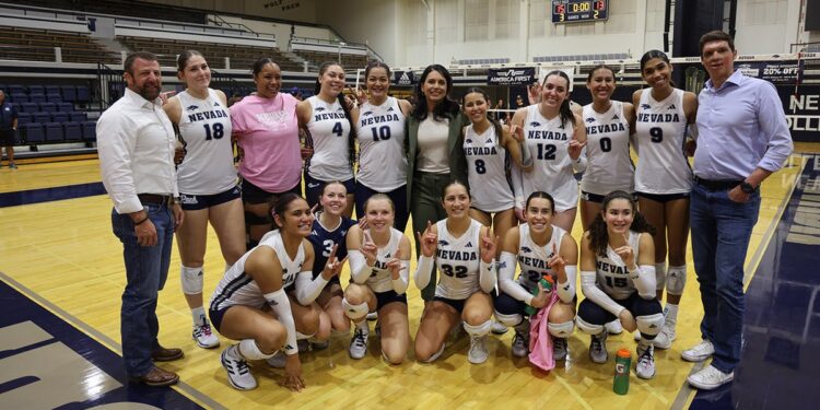 Nevada Wolf Pack women's volleyball players with Sam Brown and Tulsi Gabbard.