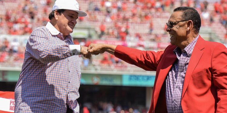 Pete Rose shares fist bump with Tony Perez