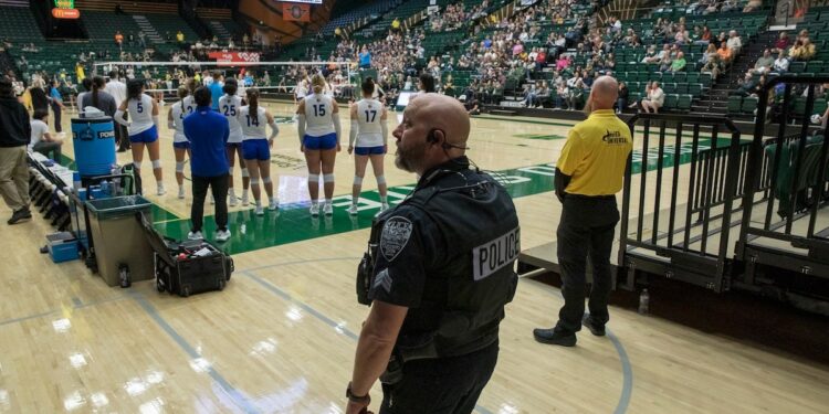 Police behind the San Jose State University Spartans bench monitor Moby Arena during an NCAA Mountain West women’s volleyball game between the Spartans and the Colorado State Rams in Fort Collins, Colorado, on Thursday, October 3, 2024.