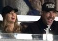 Travis Kelce and Taylor Swift have a laugh at Game 1 of the baseball AL Championship Series between the Cleveland Guardians and New York Yankees on Monday, Oct. 14, 2024 in New York City.