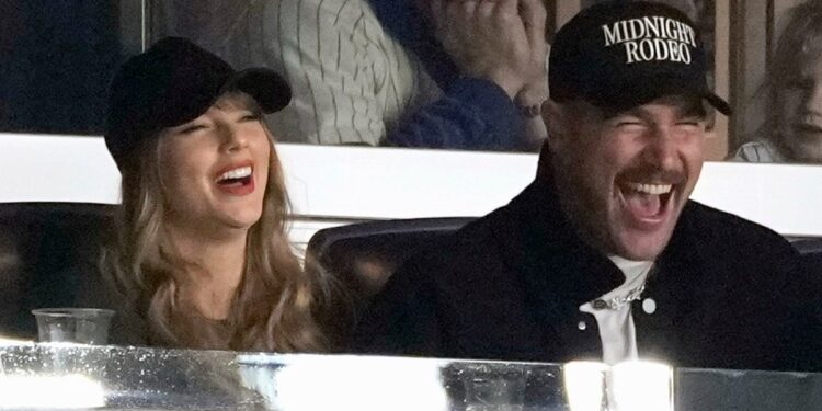 Travis Kelce and Taylor Swift have a laugh at Game 1 of the baseball AL Championship Series between the Cleveland Guardians and New York Yankees on Monday, Oct. 14, 2024 in New York City.