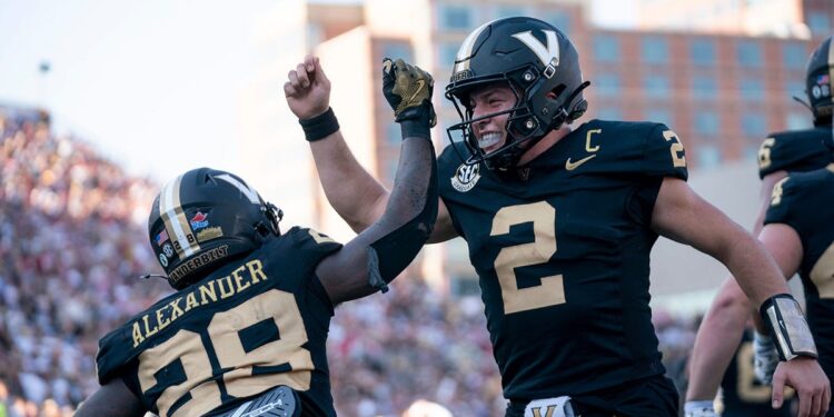 Vanderbilt football players celebrate a touchdown