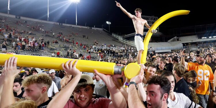 Vanderbilt fan on goal post