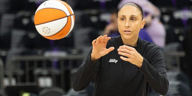 Diana Taurasi catches the basketball