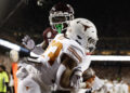 COLLEGE STATION, TEXAS - NOVEMBER 30: Jaydon Blue #23 of the Texas Longhorns catches a pass for a touchdown against Bryce Anderson #1 of the Texas A&M Aggies during the second quarter at Kyle Field on November 30, 2024 in College Station, Texas. (Photo by Tim Warner/Getty Images)