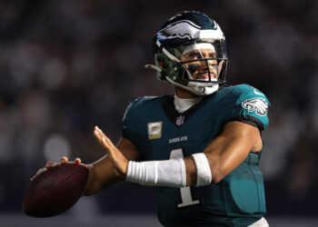 ARLINGTON, TEXAS - NOVEMBER 10: Jalen Hurts #1 of the Philadelphia Eagles throws on the sidelines during the first half against the Dallas Cowboys at AT&T Stadium on November 10, 2024 in Arlington, Texas. (Photo by Sam Hodde/Getty Images)