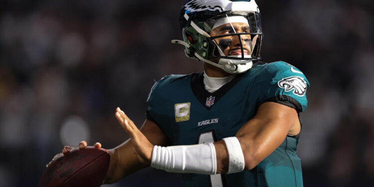 ARLINGTON, TEXAS - NOVEMBER 10: Jalen Hurts #1 of the Philadelphia Eagles throws on the sidelines during the first half against the Dallas Cowboys at AT&T Stadium on November 10, 2024 in Arlington, Texas. (Photo by Sam Hodde/Getty Images)