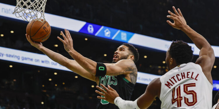 BOSTON, MASSACHUSETTS - NOVEMBER 19: Jayson Tatum #0 of the Boston Celtics shoots against Donovan Mitchell #45 of the Cleveland Cavaliers during the first quarter of the Emirates NBA Cup at TD Garden on November 19, 2024 in Boston, Massachusetts. NOTE TO USER: User expressly acknowledges and agrees that, by downloading and or using this photograph, User is consenting to the terms and conditions of the Getty Images License Agreement.  (Photo by Winslow Townson/Getty Images)