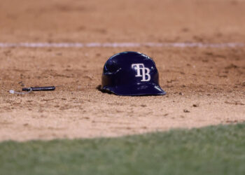 OAKLAND, CALIFORNIA - AUGUST 20: A batting helmet of a Tampa Bay Rays player sits on the field during the game against the Oakland Athletics at Oakland Coliseum on August 20, 2024 in Oakland, California. (Photo by Lachlan Cunningham/Getty Images)