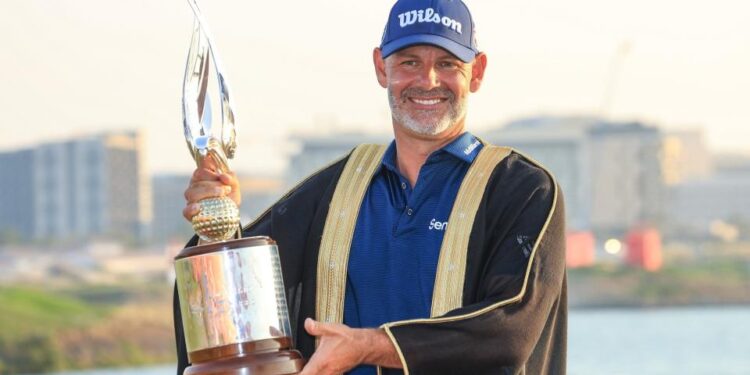 Paul Waring holds the Abu Dhabi HSBC Championship trophy