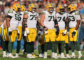 CHICAGO, ILLINOIS - NOVEMBER 17: Zach Tom #50, Sean Rhyan #75, Josh Myers #71, Elgton Jenkins #74 and Rasheed Walker #63 of the Green Bay Packers look on against the Chicago Bears at Soldier Field on November 17, 2024 in Chicago, Illinois. (Photo by Michael Reaves/Getty Images)